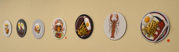 Red stickers indicate sold artwork.